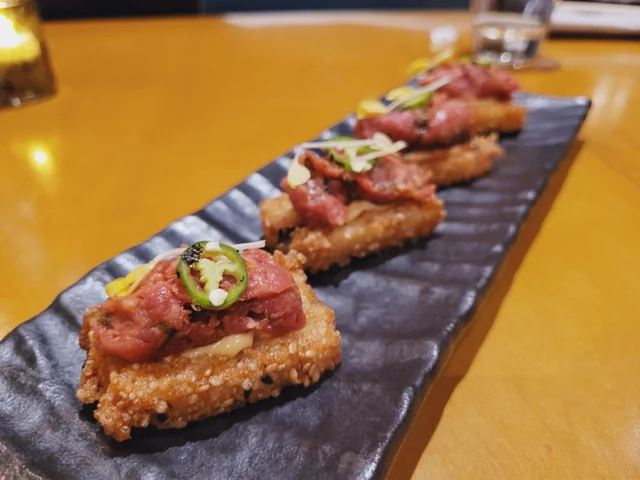 Virago signature dishes Crispy Rice with Spicy Tuna, Miso-Broiled Black Cod, Yakiniku (Hot Rock Wagyu), Signature Makimono Rolls